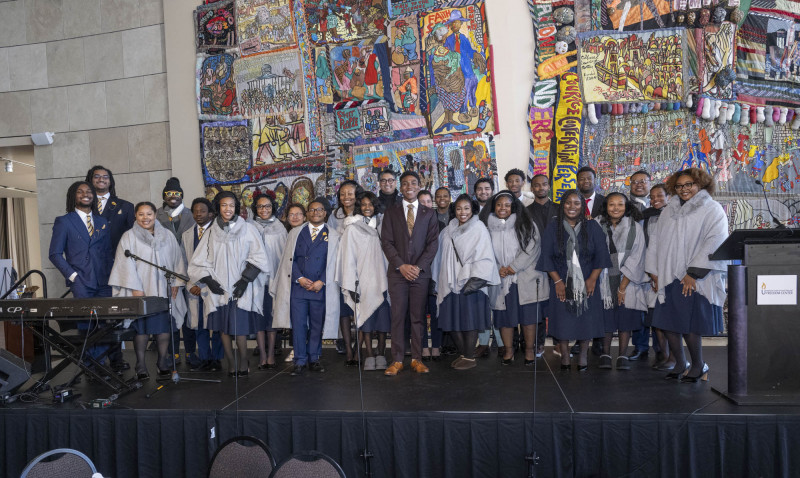 City of Cincinnati Mayor Aftab Pureval and Kahlil Greene, middle  posed for a photos with Fisk Jubilee Singers and Marian Spencers scholarship students for University of Cincinnati during the  MLK Day breakfast at the National Underground Railroad Freedom Center Monday January 19, 2026. Photos by Joseph Fuqua II