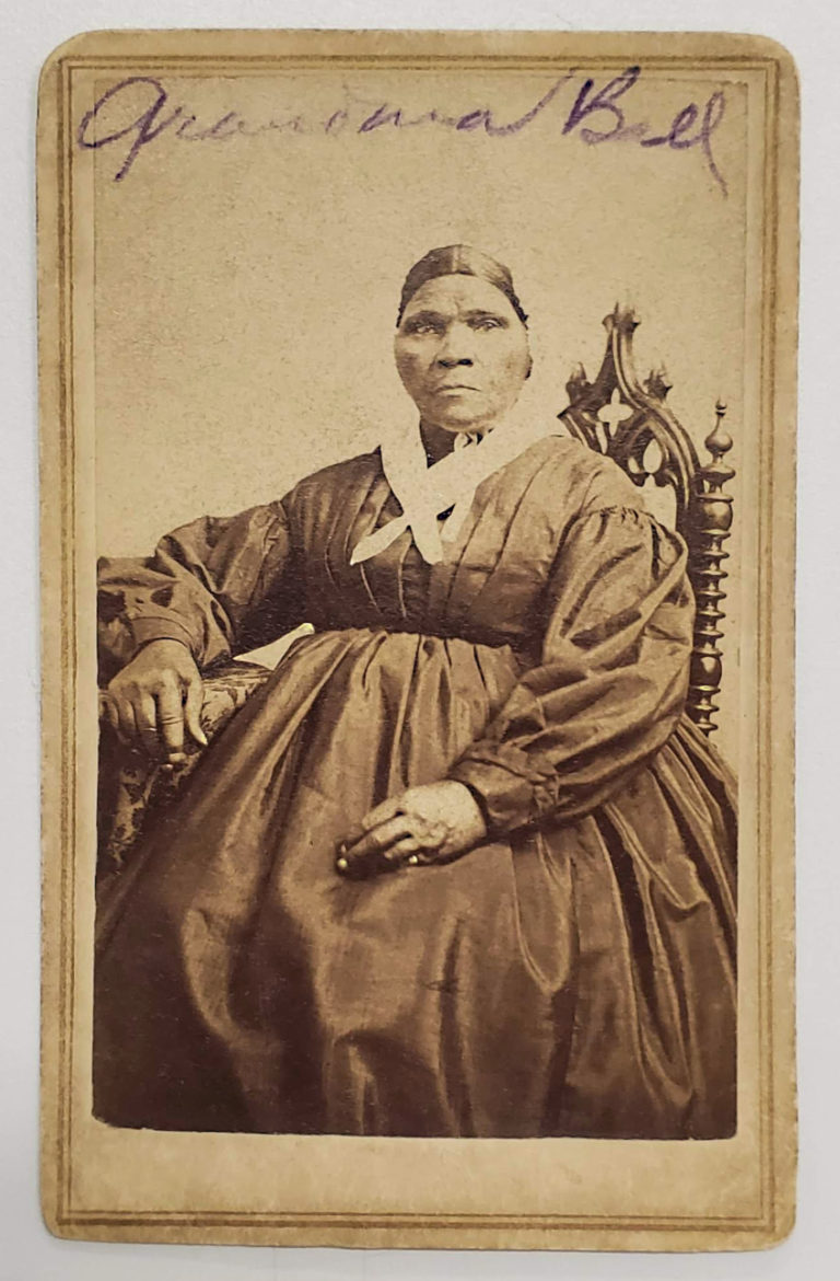 Removal of masking tape from back of Grandma Ball CDV.  J.P. Ball’s Photographic Institute. Grandma Ball, circa 1870. National Underground Railroad Freedom Center Collections. Image courtesy of Strange Stock Art Conservation.